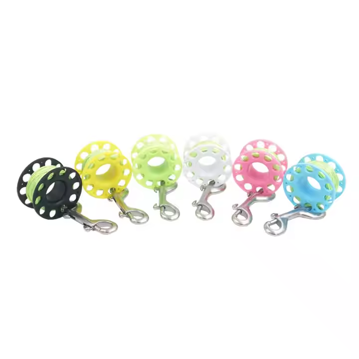 Tooke Plastic finger reel with 50ft of line and clip.